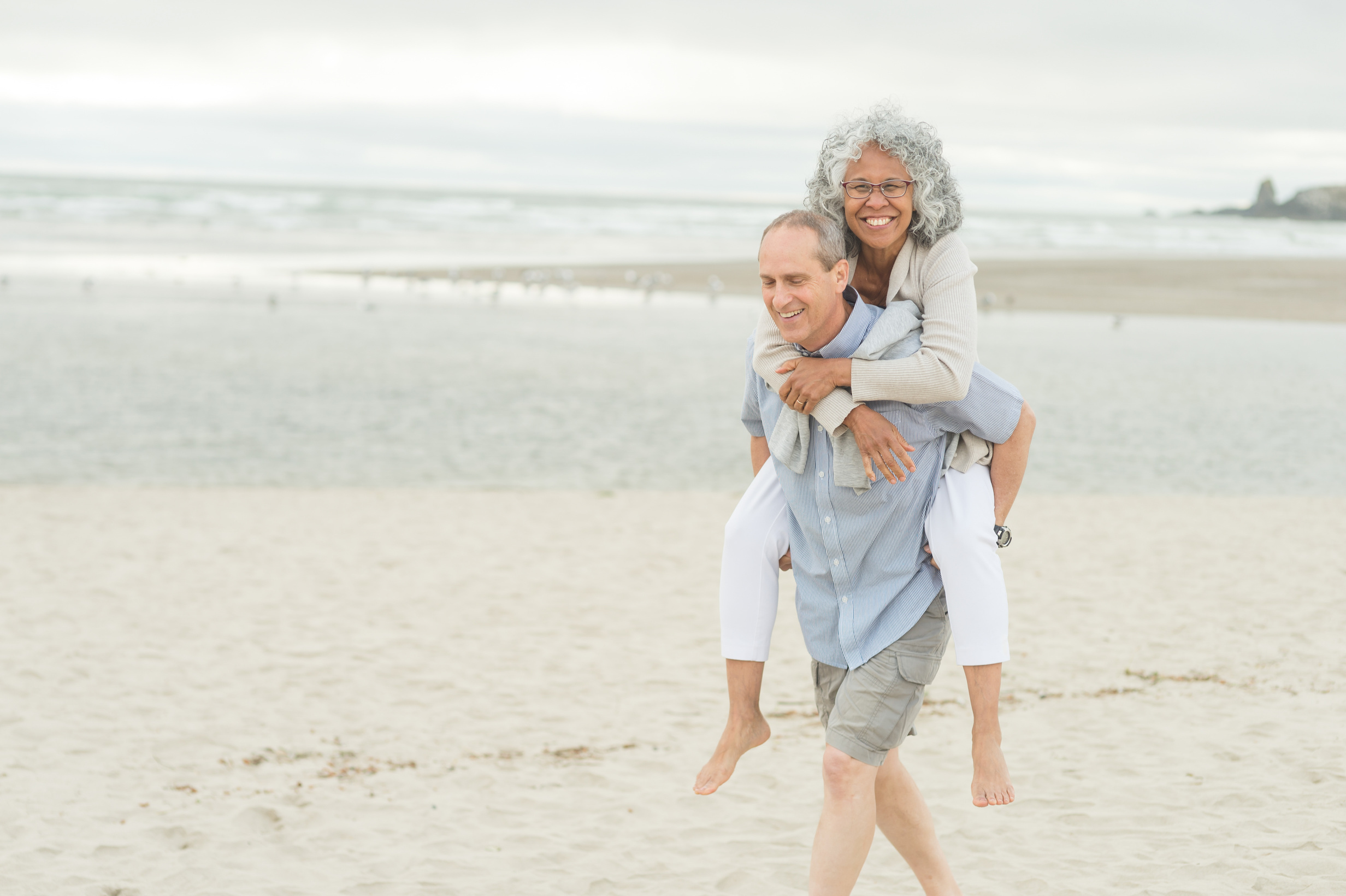 Cute Older Couple Walk on the Beach